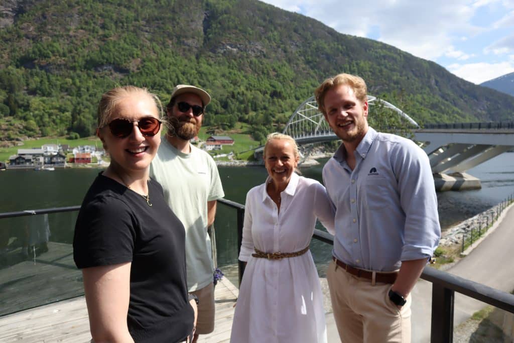 employees at rocketfarm outside rockethouse on a sunny day